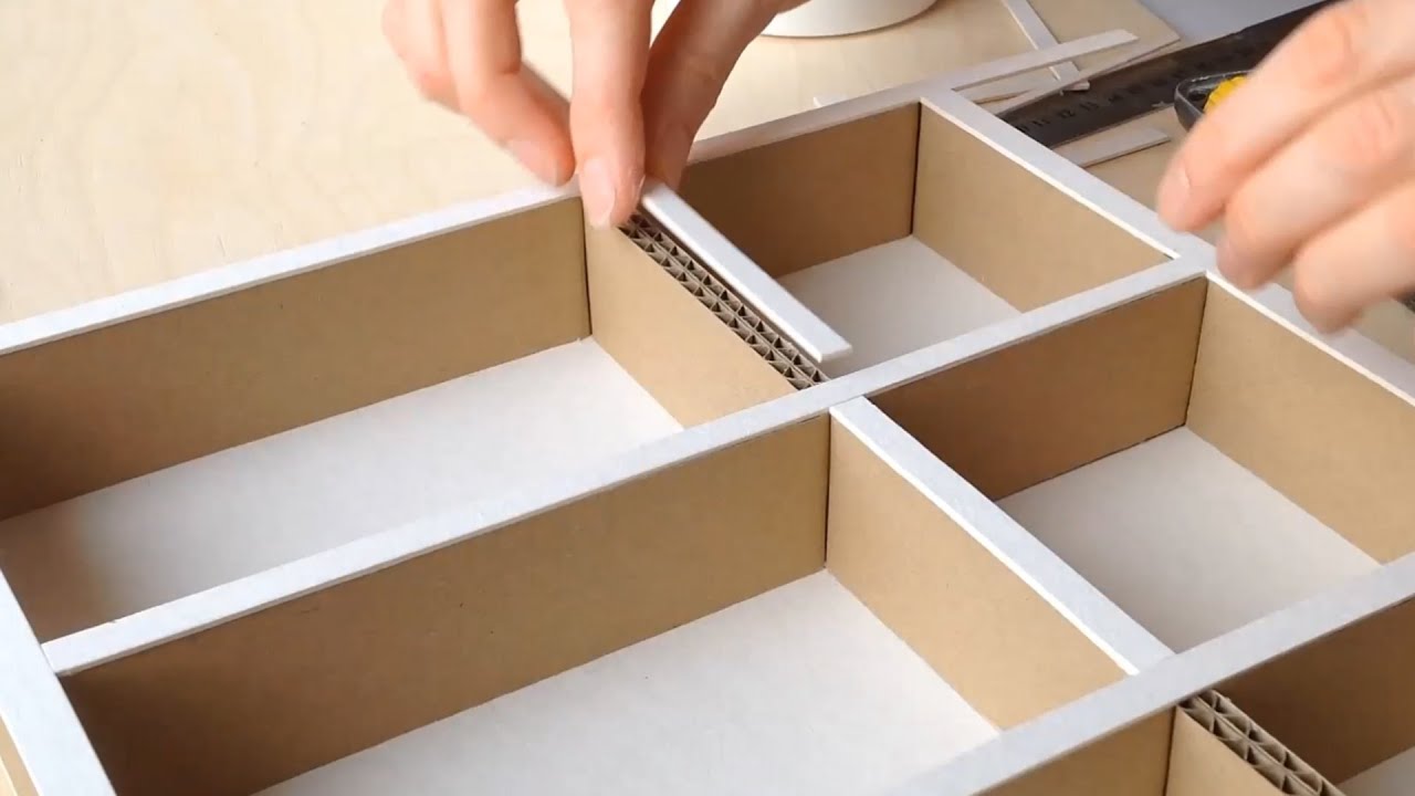 Cardboard Drawer Dividers, Begin assembling the dividers into the drawer.