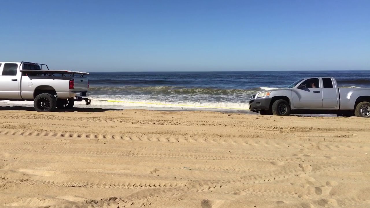 Dodge Cummins pulling stuck truck out at Pismo beach YouTube