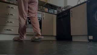 Making lunch wearing fluffy slippers and satin loungewear - walking on crumbs
