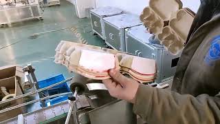 Sticker labeling machine for egg trays