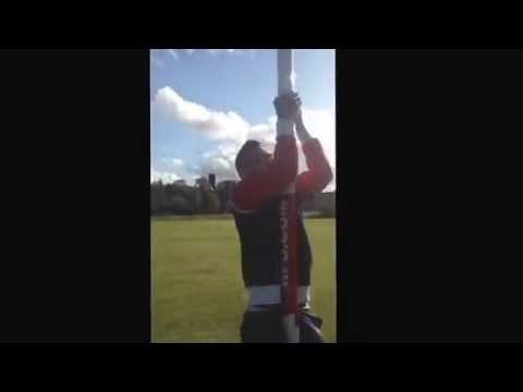 DevvoJunior - DevvoJunior tryin' to climb a rugby post