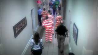 Calhoun County Sheriff's Department Officers Transporting Prisoners