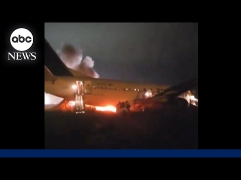 4 seriously injured after plane skids off runway and catches fire.