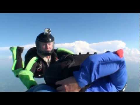 Skydivers parachute opens upside down during AFF jump.