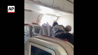 Passenger opens exit door mid-flight