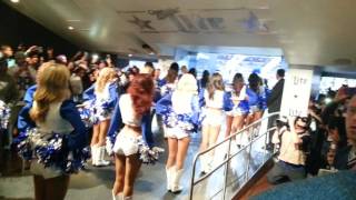 Dallas Cowboy cheerleaders leading the team out of the tunnel