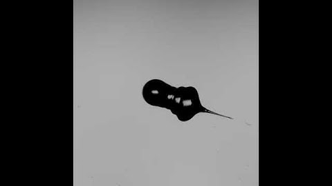 Collision of water drop with glass particle