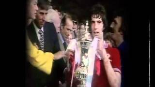 FA Cup 1977 - Man Utd 2-1 Liverpool
Buy the DVD now from http://www.tikabooson.com/DVD+Categories/FA+Cup+DVDs/1977+FA+Cup+Final+-+Man+Utd+v+Liverpool_DVD2512.htm
Back at Wembley, Manchester United were determined to make amends for their previous years defeat to Southampton, but facing treble chasing Liverpool, the Merseysiders were odds on favourite to clinch the Cup.
But it was Uniteds day as they avenged the heartache suffered 12 months earlier and denied their Northwest rivals of the much-coveted treble. Relive the day and the excitement all over again in this specially produced DVD including all the post match reaction from the newly crowned winners.
Trailer footage cleared by The FA FA Cup 1977 - Man Utd 2-1 Liverpool
