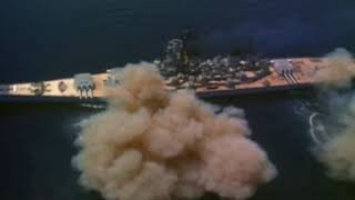 Iowa class battleship firing 16 inch guns