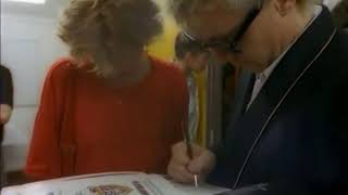 Roger Taylor "signs autograph" in 1986