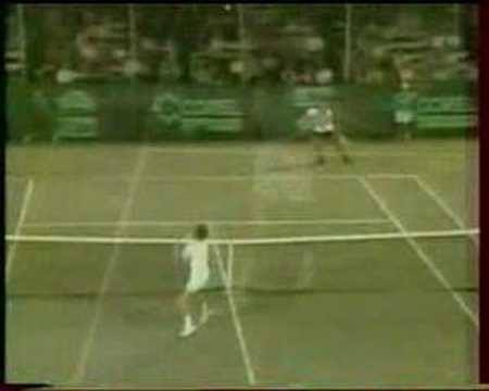 Connors throwing racquet in the air and winning the point