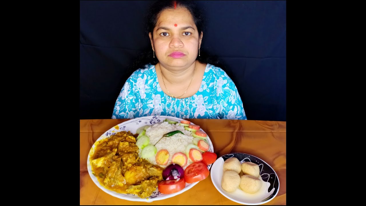 Basanti eating rice, mutton kosha, salad, sweets