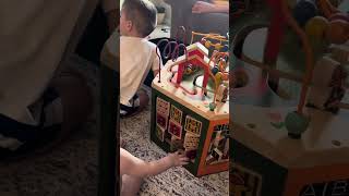 The Boys playing with their B. Toys Wooden Activity Cube - Youniversity