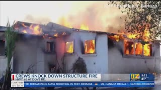 Crews knock down structure fire on Highway 65 at Dove Road