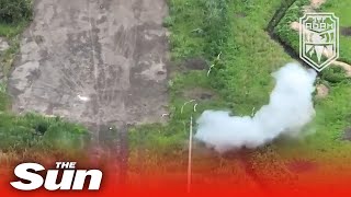 Shock Ukrainian weaponised drone attacks two unaware Russian soldiers