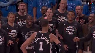 Victor Wembanyama striking a pose in front of the Spurs benchThis is amazing