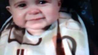 Baby cries while mother sings