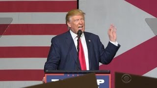 Trump lashes out at media; Michelle Obama blasts Trump