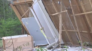 Woman rescued after becoming entrapped in mobile home after tornado