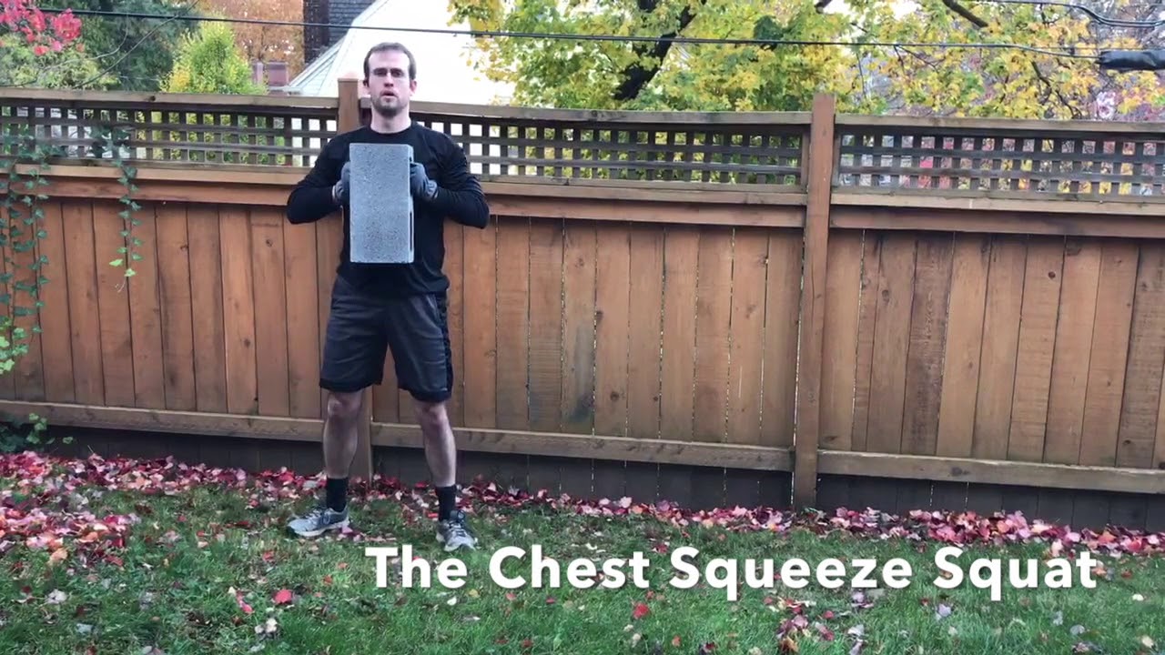 The Cinder Block Chest Squeeze Squat