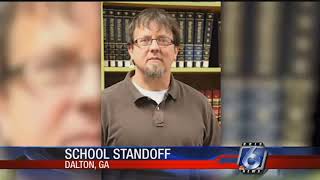 Teacher barricades himself in class, fires gun; no one hurt