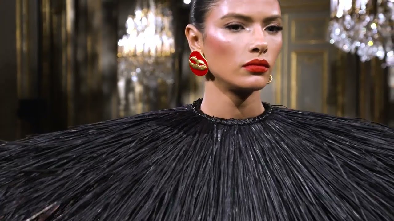 Kendall Jenner dons a red dress adorned with hundreds of fingernails