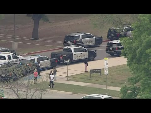 Irving high school on lockdown due to 'possible threat' of a student with a gun on campus, police sa