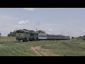 Пассажирский поезд плавно скатывается к морю 4K/ Passenger train smoothly rolls down to the sea 4K