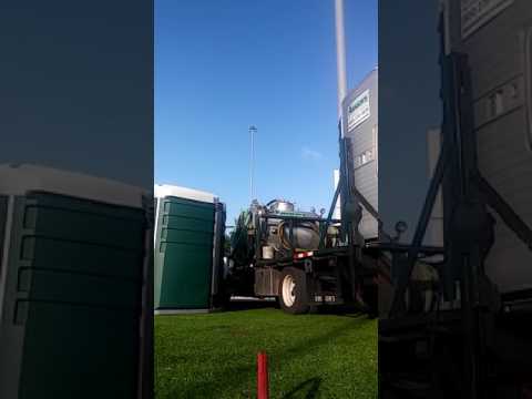 2 extra large ADA portable toilets loaded by hand.