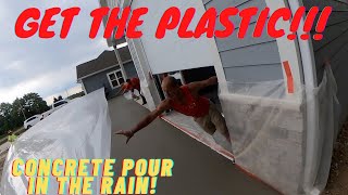Pouring  concrete when it starts to rain!