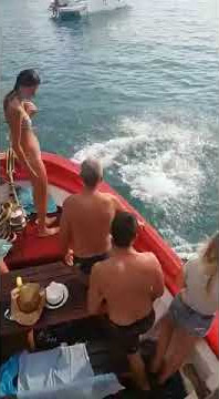 Vibes  guy slips on red boat falls into water