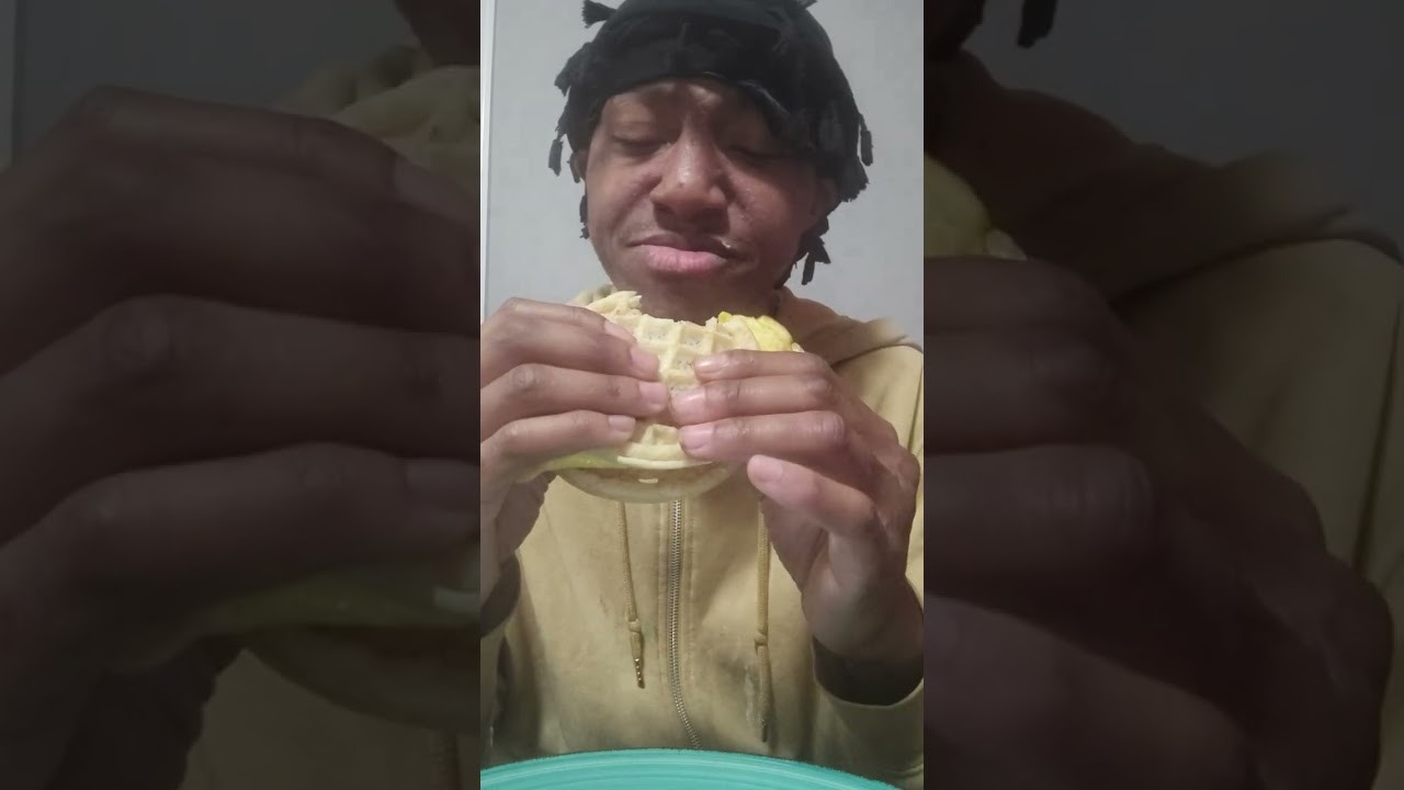 Eating oatmeal with jelly waffles with eggs sandwich 