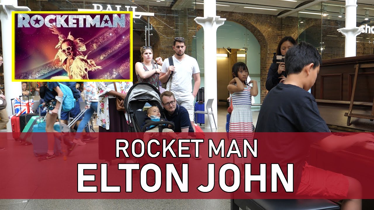 Elton John Rocket Man Soothes a Baby Cole Lam 12 Years Old