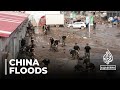 Areas in China hit by floods remain cut off two weeks after storms