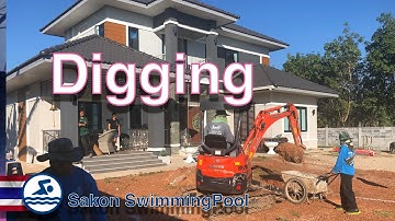 Digging out a swimming pool with a small excavator,