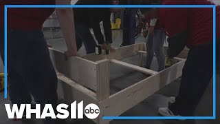 Metro United Way volunteers build 100 beds for children in need