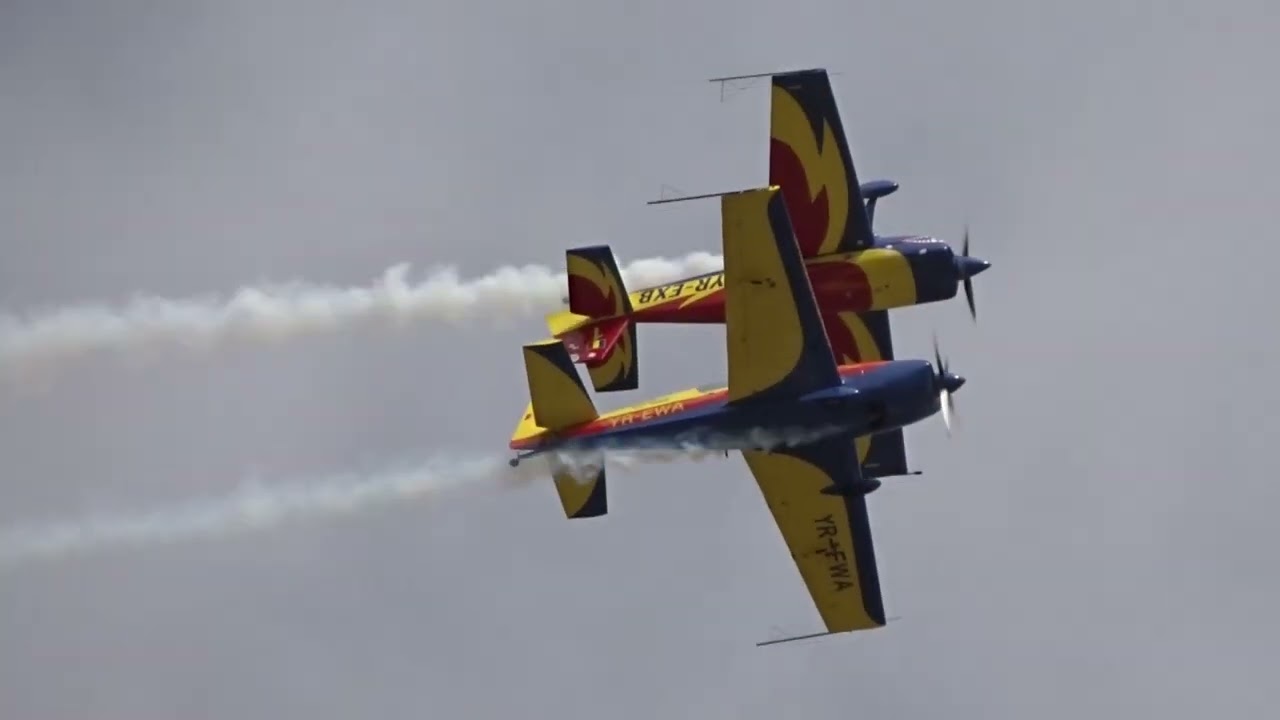 Crazy aerobatics on the Extra 300L YR-EWA airplane. Flying upside down above the airplane