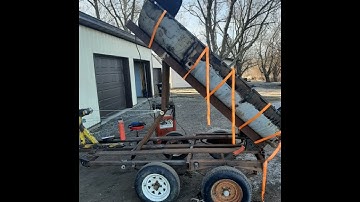 Homemade dump trailer with a winch.