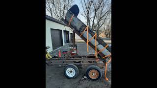 Homemade dump trailer with a winch.