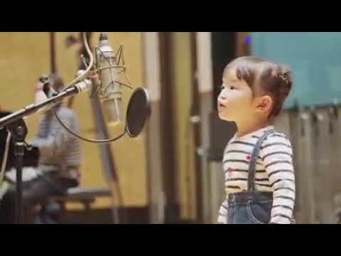 Little Japanese girl sings a song about a kitty