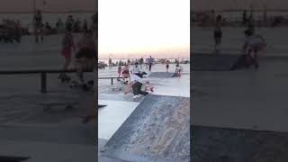 Skateboarder runs into girl on roller skates at the skatepark