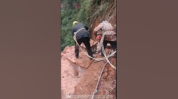Workers Removing Dangerous Rocks