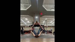 Partner acro glided straddle throne pose tutorial