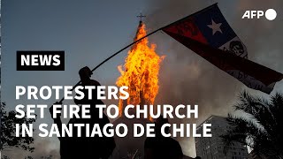 Church torched as people mark Chile protest anniversary in Santiago | AFP
