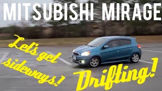 2019 Mitsubishi Mirage drifting in the rain