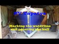 Marking the waterline and painting the hull; Building a cruising sailboat - SV Tapatya EP147