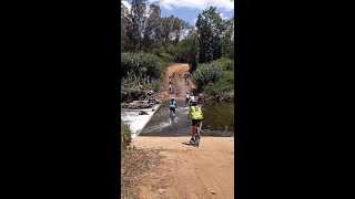 Lindsey crossing the river during the 94.7 mountain bike challenge