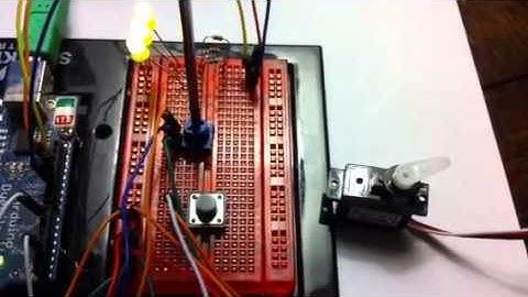 Arduino circuit using button, pot, servo, and Leds