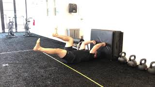 Wall push alternating deadbug