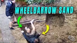 Man's Wheelbarrow Mishap Due to Wet Sand